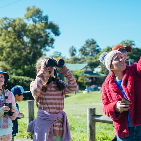 Child looking through binoculars