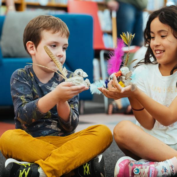 Children making craft at the library