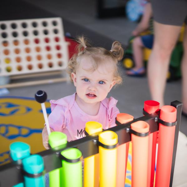 Child playing with toys at library