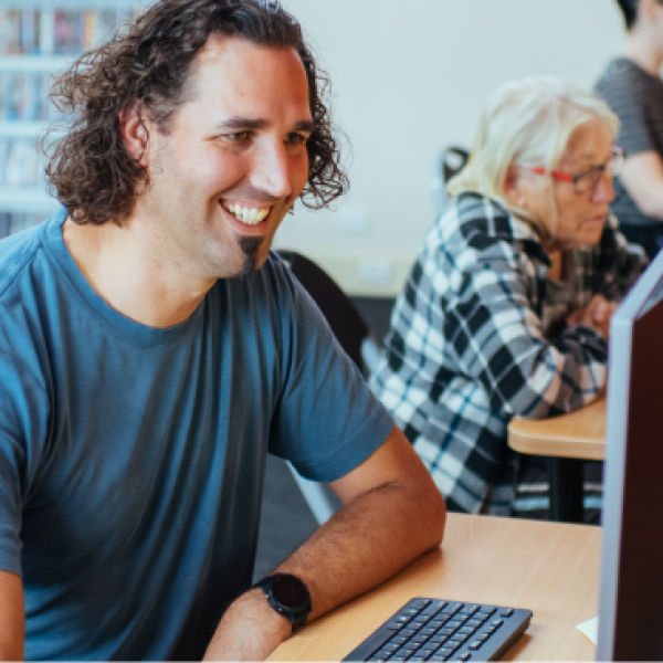 Man sitting at computer at library