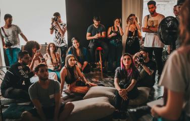 Group of people listening to author talk